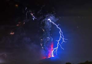 View from Frutillar, southern Chile, of lava spewing from the Calbuco volcano, on April 23, 2015. Chile's Calbuco volcano erupted on Wednesday, spewing a giant funnel of ash high into the sky near the southern port city of Puerto Montt and triggering a red alert. Authorities ordered an evacuation for a 10-kilometer (six-mile) radius around the volcano, which is the second in southern Chile to have a substantial eruption since March 3, when the Villarrica volcano emitted a brief but fiery burst of ash and lava. AFP PHOTO/MARTIN BERNETTIMARTIN BERNETTI/AFP/Getty Images